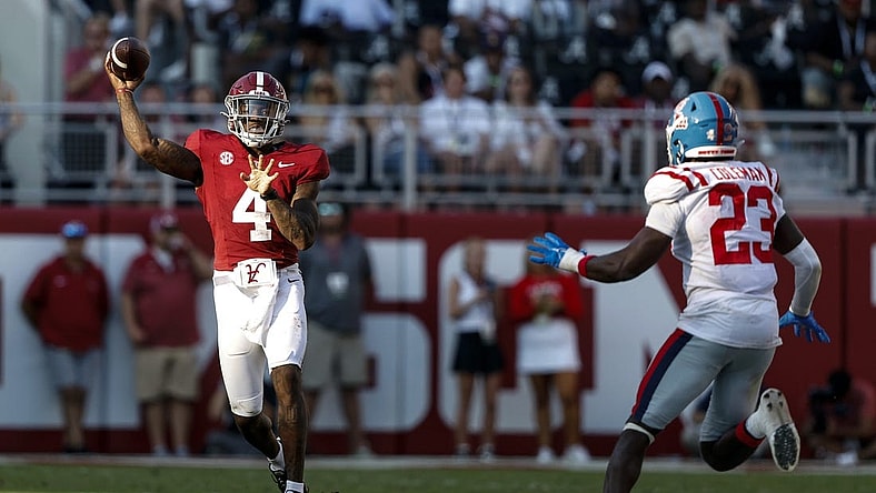 Sep 23, 2023; Tuscaloosa, Alabama, USA; Alabama Crimson Tide quarterback Jalen Milroe (4) throws a pass against the Mississippi Rebels during the second half of a football game at Bryant-Denny Stadium. Mandatory Credit: Butch Dill-USA TODAY Sports