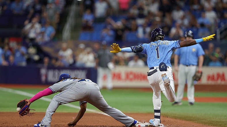 Sep 23, 2023; St. Petersburg, Florida, USA;  Tampa Bay Rays designated hitter Junior Caminero (1) is safe at first after an overturned out call against the Toronto Blue Jays in the ninth inning at Tropicana Field. Mandatory Credit: Nathan Ray Seebeck-USA TODAY Sports