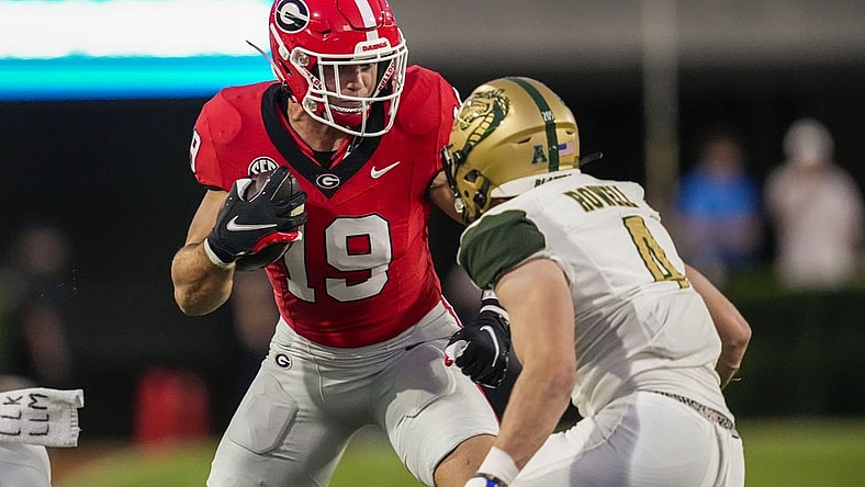Sep 23, 2023; Athens, Georgia, USA; Georgia Bulldogs tight end Brock Bowers (19) runs against UAB Blazers safety Ike Rowell (4) after a catch during the first quarter at Sanford Stadium. Mandatory Credit: Dale Zanine-USA TODAY Sports