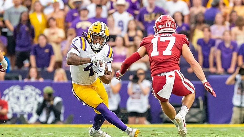 Runningback John Emery Jr 4 runs the ball as the LSU Tigers take on the Arkansas Razorbacks at Tiger Stadium in Baton Rouge, Louisiana, Sept. 23, 2023.