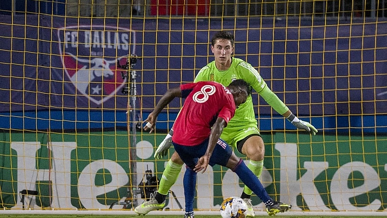 Sep 23, 2023; Frisco, Texas, USA; Columbus Crew goalkeeper Patrick Schulte (28) stops a shot by FC Dallas forward Jader Obrian (8) during the first half at Toyota Stadium. Mandatory Credit: Jerome Miron-USA TODAY Sports