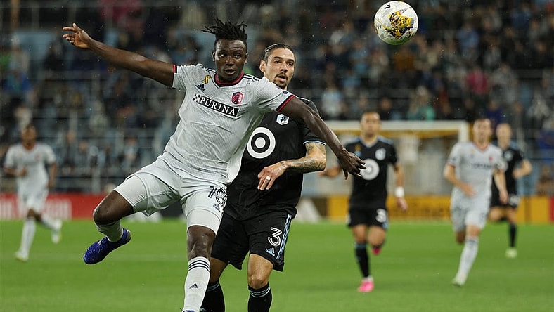 Sep 23, 2023; Saint Paul, Minnesota, USA; St. Louis City SC defender Joshua Yaro (15) battles Minnesota United FC defender Zarek Valentin (3) for the ball in the first half at Allianz Field. Mandatory Credit: Matt Krohn-USA TODAY Sports