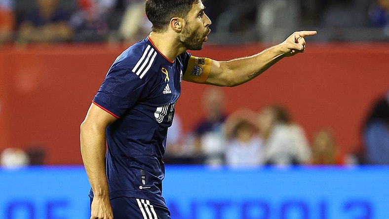 Sep 23, 2023; Chicago, Illinois, USA; New England Revolution midfielder Carles Gil (10) reacts after scoring a goal against the Chicago Fire during the second half at Soldier Field. Mandatory Credit: Mike Dinovo-USA TODAY Sports