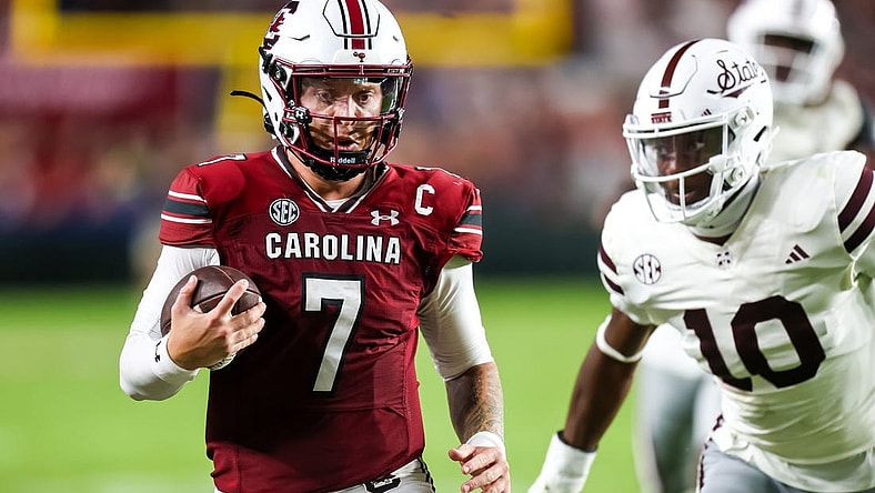 Sep 23, 2023; Columbia, South Carolina, USA; South Carolina Gamecocks quarterback Spencer Rattler (7) scrambles against the Mississippi State Bulldogs in the second half at Williams-Brice Stadium. Mandatory Credit: Jeff Blake-USA TODAY Sports