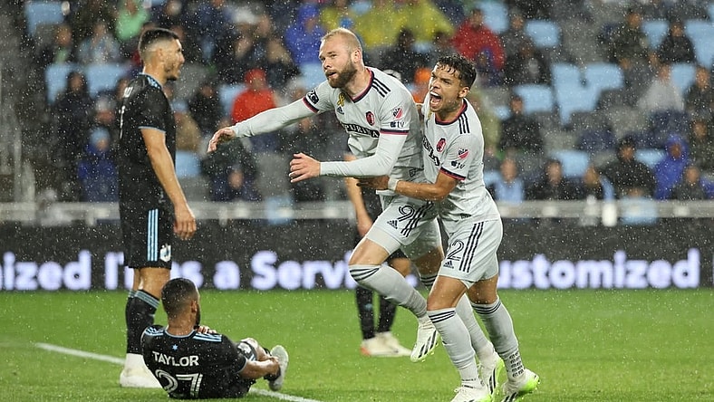 Sep 23, 2023; Saint Paul, Minnesota, USA; St. Louis City SC forward Klauss (9) celebrates goal with midfielder Celio Pompeu (12) in the second half against the Minnesota United FC at Allianz Field. Mandatory Credit: Matt Krohn-USA TODAY Sports