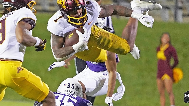Sep 23, 2023; Evanston, Illinois, USA; Minnesota Golden Gophers running back Darius Taylor (1) leaps over Northwestern Wildcats linebacker Kenny Soares Jr. (35) during the second half at Ryan Field. Mandatory Credit: David Banks-USA TODAY Sports