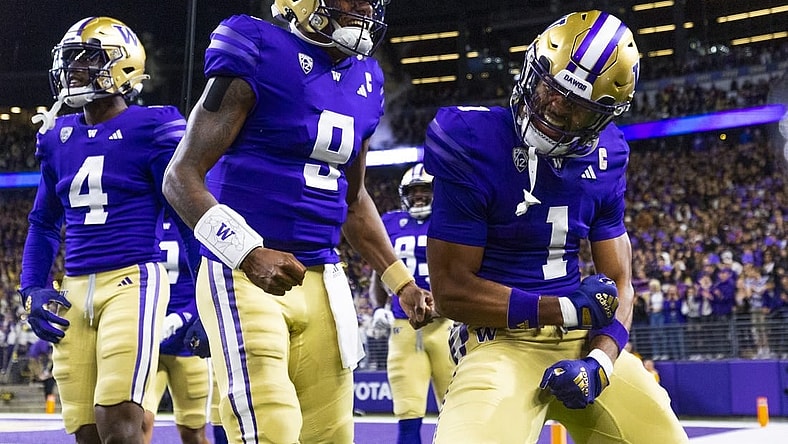 Sep 23, 2023; Seattle, Washington, USA; Washington Huskies wide receiver Rome Odunze (1) celebrates with quarterback Michael Penix Jr. (9) after returning a punt for a touchdown during the first quarter at Alaska Airlines Field at Husky Stadium. Mandatory Credit: Joe Nicholson-USA TODAY Sports