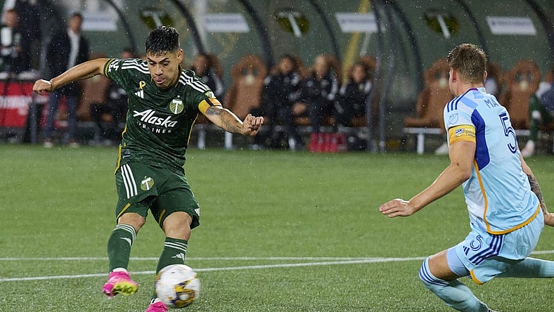 Sep 23, 2023; Portland, Oregon, USA; Portland Timbers forward Felipe Mora (9) takes a shot on goal during the second half against Colorado Rapids defender Andreas Maxso (5) at Providence Park. Mandatory Credit: Troy Wayrynen-USA TODAY Sports