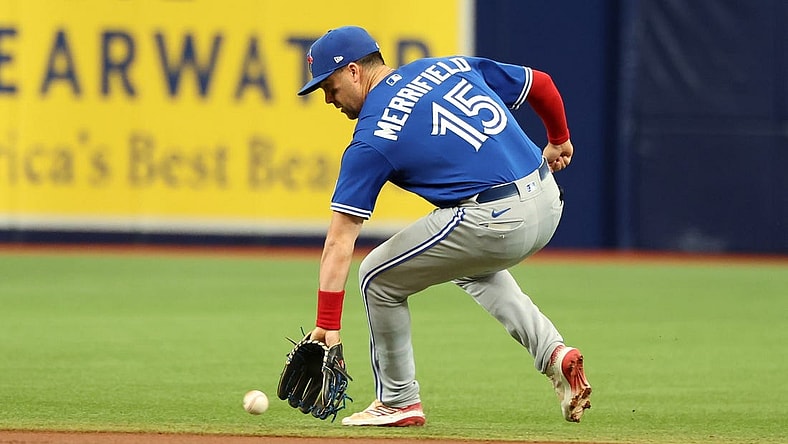 Sep 24, 2023; St. Petersburg, Florida, USA; Toronto Blue Jays second baseman Whit Merrifield (15) fields the ball against the Tampa Bay Rays during the first inning   at Tropicana Field. Mandatory Credit: Kim Klement Neitzel-USA TODAY Sports