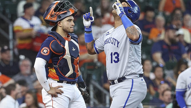 Sep 24, 2023; Houston, Texas, USA; Houston Astros catcher Yainer Diaz (21) looks on as Kansas City Royals designated hitter Salvador Perez (13) celebrates after hitting a home run during the third inning at Minute Maid Park. Mandatory Credit: Troy Taormina-USA TODAY Sports