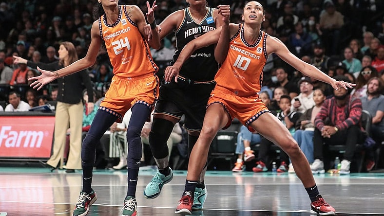 Sep 24, 2023; Brooklyn, New York, USA; New York Liberty forward Jonquel Jones (35) boxes out for a rebound on Connecticut Sun forwards DeWanna Bonner (24) and Olivia Nelson-Ododa (10) in the third quarter during game one of the 2023 WNBA Playoffs at Barclays Center. Mandatory Credit: Wendell Cruz-USA TODAY Sports