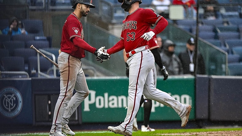Sep 24, 2023; Bronx, New York, USA; Arizona Diamondbacks first baseman Christian Walker (53) is greeted by Arizona Diamondbacks shortstop Jordan Lawlar (10) after scoring on a two RBI single by Arizona Diamondbacks third baseman Evan Longoria (not pictured) during the seventh inning against the New York Yankees at Yankee Stadium. Mandatory Credit: John Jones-USA TODAY Sports