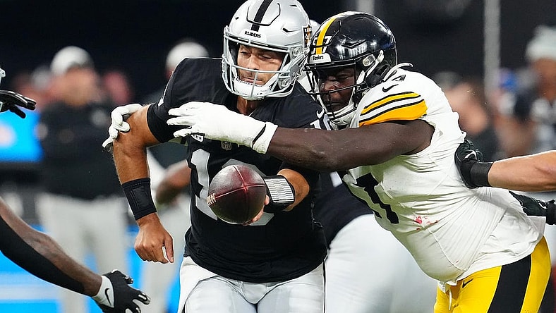 Sep 24, 2023; Paradise, Nevada, USA; Pittsburgh Steelers defensive tackle Montravius Adams (57) pressures Las Vegas Raiders quarterback Jimmy Garoppolo (10) during the first quarter at Allegiant Stadium. Mandatory Credit: Stephen R. Sylvanie-USA TODAY Sports