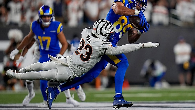 Sep 25, 2023; Cincinnati, Ohio, USA; Los Angeles Rams tight end Tyler Higbee (89) catches a pass over Cincinnati Bengals safety Dax Hill (23) in the second quarter of the NFL Week 3 game between the Cincinnati Bengals and the Los Angeles Rams at Paycor Stadium. Mandatory Credit: Sam Greene-USA TODAY Sports