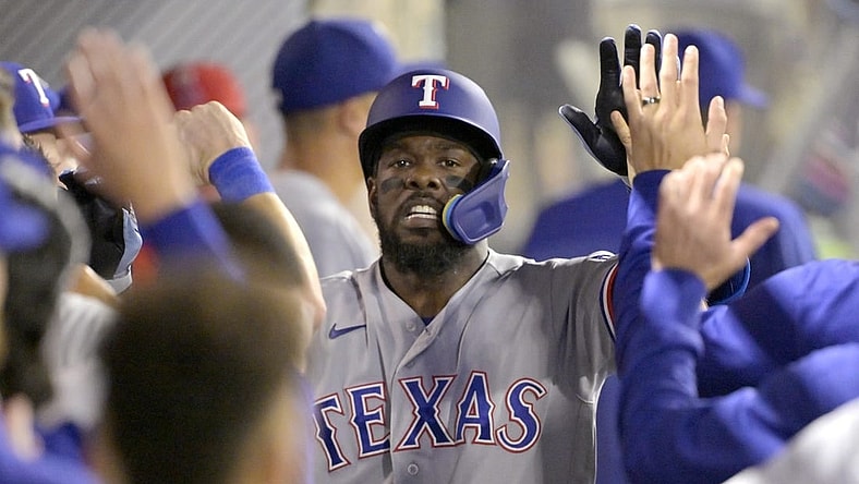 Sep 25, 2023; Anaheim, California, USA; Texas Rangers right fielder Adolis Garcia (53) celebrates in the dugout after hitting a solo home run in the sixth inning against the Los Angeles Angels at Angel Stadium. Mandatory Credit: Jayne Kamin-Oncea-USA TODAY Sports