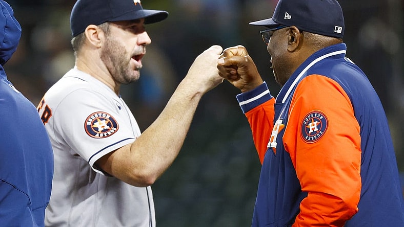 Sep 25, 2023; Seattle, Washington, USA; Houston Astros manager Dusty Baker Jr. (12, right) bumps fists with starting pitcher Justin Verlander (35) following a 5-1 victory against the Seattle Mariners at T-Mobile Park. Mandatory Credit: Joe Nicholson-USA TODAY Sports