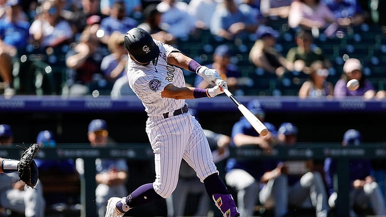 -Sep 26, 2023; Denver, Colorado, USA; Colorado Rockies shortstop Ezequiel Tovar (14) hits a double in the second inning against the Los Angeles Dodgers at Coors Field. Mandatory Credit: Isaiah J. Downing-USA TODAY Sports