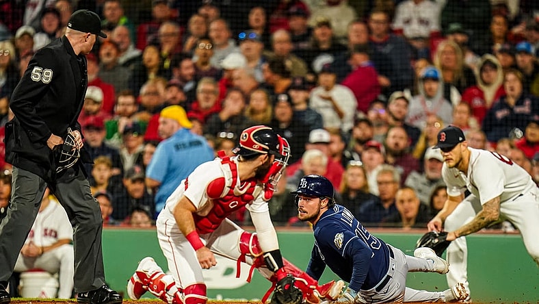 Sep 26, 2023; Boston, Massachusetts, USA; Tampa Bay Rays right fielder Josh Lowe (15) safe at home plate against Boston Red Sox catcher Reese McGuire (3) in the third inning at Fenway Park. Mandatory Credit: David Butler II-USA TODAY Sports