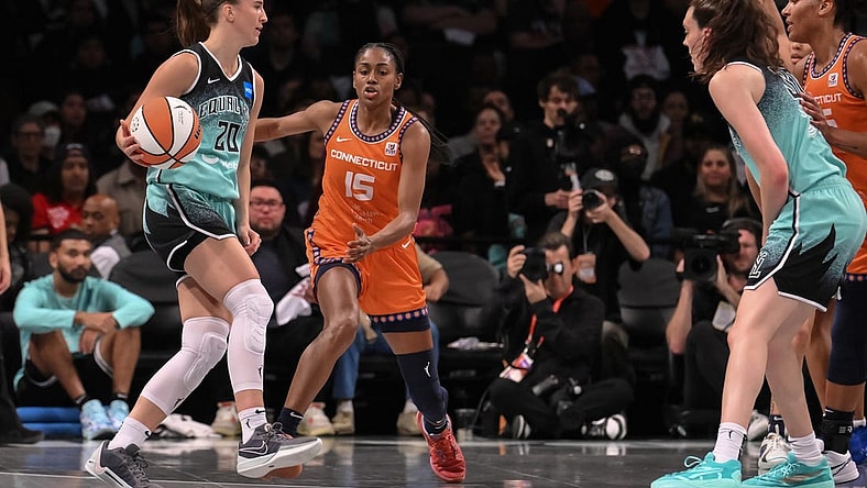 Sep 26, 2023; Brooklyn, New York, USA; New York Liberty guard Sabrina Ionescu (20) sets the play as Connecticut Sun guard Tiffany Hayes (15) defends during the first half of game two of the 2023 WNBA Playoffs at Barclays Center. Mandatory Credit: John Jones-USA TODAY Sports
