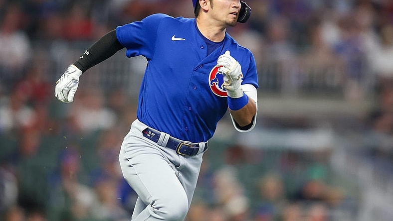 Sep 26, 2023; Atlanta, Georgia, USA; Chicago Cubs right fielder Seiya Suzuki (27) hits a two-run triple against the Atlanta Braves in the third inning at Truist Park. Mandatory Credit: Brett Davis-USA TODAY Sports