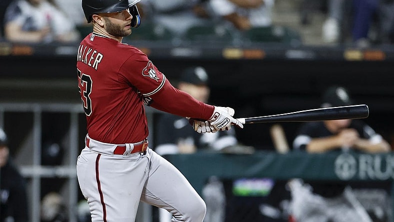 Sep 26, 2023; Chicago, Illinois, USA; Arizona Diamondbacks first baseman Christian Walker (53) hits a three-run triple against the Chicago White Sox during the fifth inning at Guaranteed Rate Field. Mandatory Credit: Kamil Krzaczynski-USA TODAY Sports