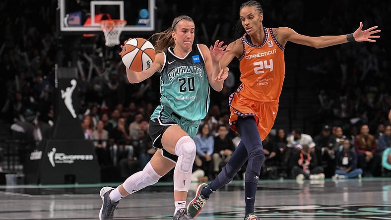 Sep 26, 2023; Brooklyn, New York, USA; New York Liberty guard Sabrina Ionescu (20) drives to the basket against Connecticut Sun forward DeWanna Bonner (24) during the second half of game two of the 2023 WNBA Playoffs at Barclays Center. Mandatory Credit: John Jones-USA TODAY Sports
