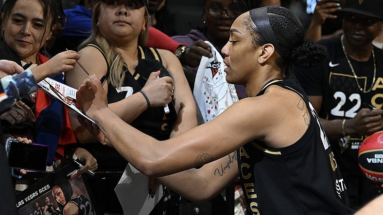 Sep 26, 2023; Las Vegas, Nevada, USA; Las Vegas Aces forward A'ja Wilson (22) signs autographs after defeating the Dallas Wings in game two of the 2023 WNBA Playoffs at Michelob Ultra Arena. Mandatory Credit: Candice Ward-USA TODAY Sports