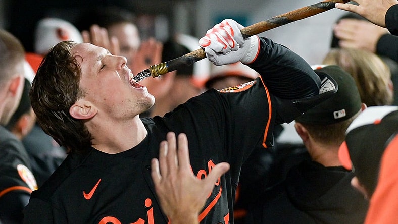 Sep 27, 2023; Baltimore, Maryland, USA; Baltimore Orioles designated hitter Adley Rutschman (35) drinks from the homer hose after hitting a third inning homer run against the Washington Nationals at Oriole Park at Camden Yards. Mandatory Credit: Tommy Gilligan-USA TODAY Sports