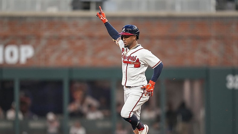 Sep 27, 2023; Cumberland, Georgia, USA; Atlanta Braves second baseman Ozzie Albies (1) reacts after hitting a home run against the Chicago Cubs during the first inning at Truist Park. Mandatory Credit: Dale Zanine-USA TODAY Sports