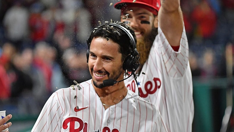 Sep 27, 2023; Philadelphia, Pennsylvania, USA; Philadelphia Phillies catcher Garrett Stubbs (21) has sunflower seeds dumped on him by center fielder Brandon Marsh (16) after win against the Pittsburgh Pirates at Citizens Bank Park. Mandatory Credit: Eric Hartline-USA TODAY Sports