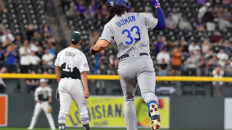 Sep 27, 2023; Denver, Colorado, USA; Los Angeles Dodgers center fielder James Outman (33) pumps his fist after hitting a 382ft home run off of Colorado Rockies starting pitcher Noah Davis (63) during the third inning at Coors Field. Mandatory Credit: John Leyba-USA TODAY Sports