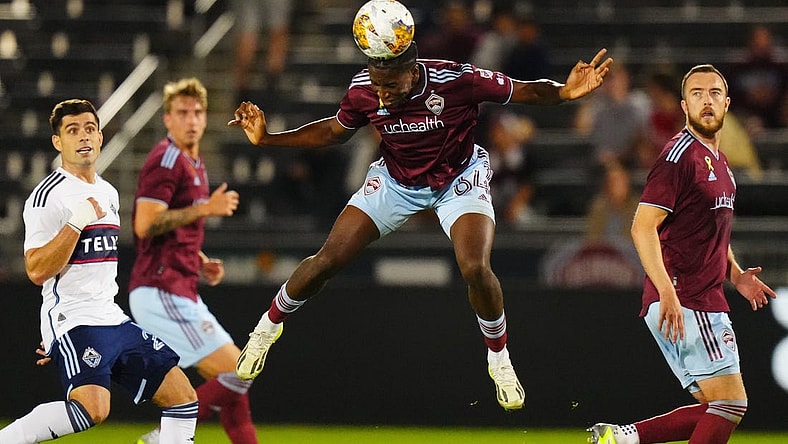 Sep 27, 2023; Commerce City, Colorado, USA; Colorado Rapids defender Moise Bombiio (64) heads the ball in the first half against the Vancouver Whitecaps FC at Dick's Sporting Goods Park. Mandatory Credit: Ron Chenoy-USA TODAY Sports