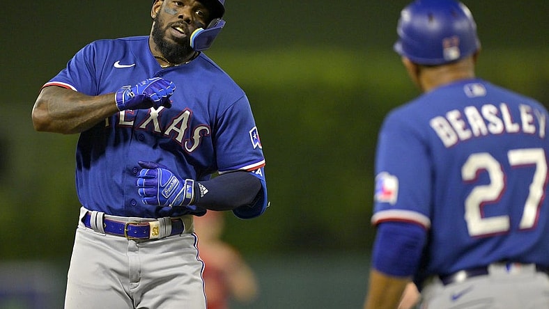 Sep 27, 2023; Anaheim, California, USA;  Texas Rangers right fielder Adolis Garcia (53) taps his chest as he rounds the bases after a solo home run in the third inning against the Los Angeles Angels at Angel Stadium. Mandatory Credit: Jayne Kamin-Oncea-USA TODAY Sports