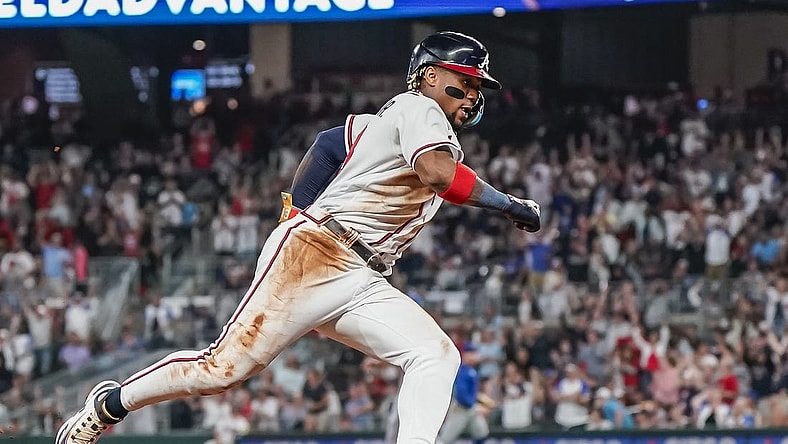 Sep 27, 2023; Cumberland, Georgia, USA; Atlanta Braves right fielder Ronald Acuna Jr. (13) rounds third base on his way to scoring a run against the Chicago Cubs during the eighth inning at Truist Park. Mandatory Credit: Dale Zanine-USA TODAY Sports