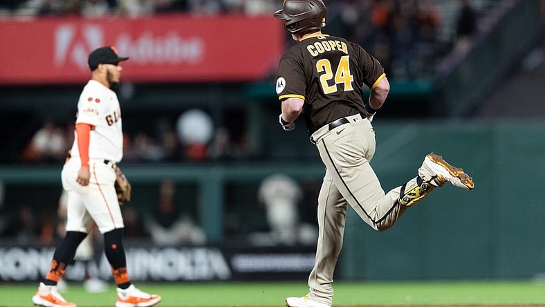 Sep 27, 2023; San Francisco, California, USA; San Diego Padres first baseman Garrett Cooper (24) runs the bases after hitting a solo home run against the San Francisco Giants during the seventh inning at Oracle Park. Mandatory Credit: John Hefti-USA TODAY Sports