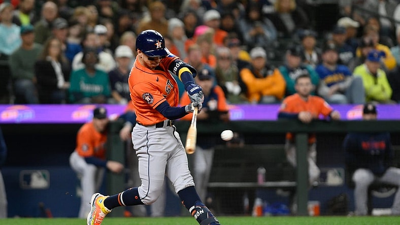 Sep 27, 2023; Seattle, Washington, USA; Houston Astros center fielder Mauricio Dubon (14) hits a 3-run home run against the Seattle Mariners during the fourth inning at T-Mobile Park. Mandatory Credit: Steven Bisig-USA TODAY Sports