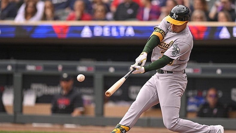 Sep 28, 2023; Minneapolis, Minnesota, USA; Oakland Athletics outfielder J.J. Bleday (33) hits a single against the Minnesota Twins during the second inning at Target Field. Mandatory Credit: Nick Wosika-USA TODAY Sports