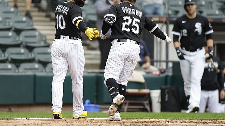 Sep 28, 2023; Chicago, Illinois, USA; Chicago White Sox first baseman Andrew Vaughn (25) celebrates with third baseman Yoan Moncada (10) after hitting a two-run home run against the Arizona Diamondbacks during the second inning at Guaranteed Rate Field. Mandatory Credit: Kamil Krzaczynski-USA TODAY Sports