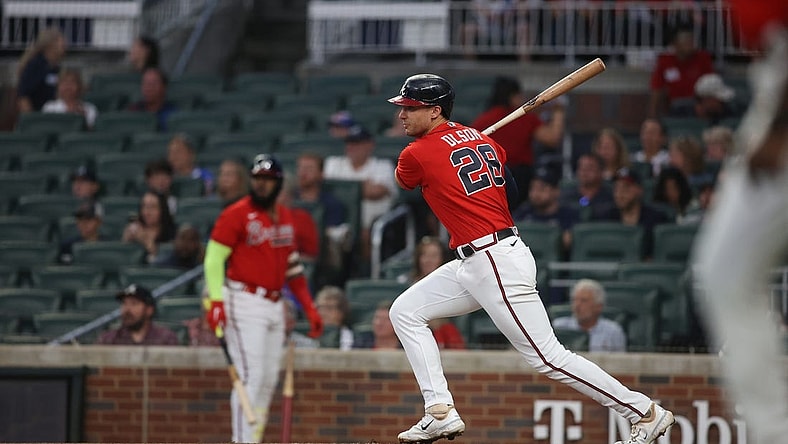 Sep 29, 2023; Atlanta, Georgia, USA; Atlanta Braves first baseman Matt Olson (28) hits a RBI single against the Washington Nationals in the first inning at Truist Park. Mandatory Credit: Brett Davis-USA TODAY Sports