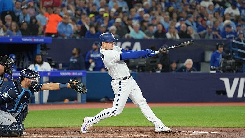 Sep 29, 2023; Toronto, Ontario, CAN; Toronto Blue Jays third baseman Matt Chapman (26) hits a double against the Tampa Bay Rays during the third inning at Rogers Centre. Mandatory Credit: Nick Turchiaro-USA TODAY Sports
