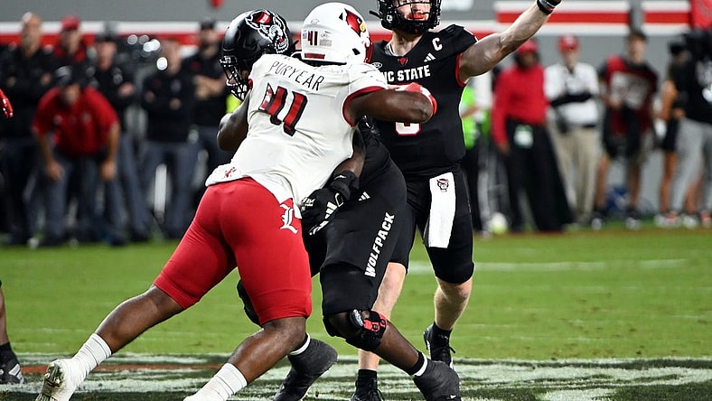 Sep 29, 2023; Raleigh, North Carolina, USA; North Carolina State Wolfpack quarterback Brennan Armstrong (5) throws a pass during the first half against the Louisville Cardinals at Carter-Finley Stadium. Mandatory Credit: Rob Kinnan-USA TODAY Sports