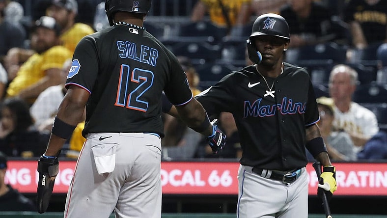 Sep 29, 2023; Pittsburgh, Pennsylvania, USA; Miami Marlins center fielder Jazz Chisholm Jr. (right) congratulates designated hitter Jorge Soler (12) after Soler scored a run against the Pittsburgh Pirates during the eighth inning at PNC Park. Mandatory Credit: Charles LeClaire-USA TODAY Sports