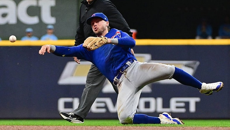Sep 29, 2023; Milwaukee, Wisconsin, USA; Chicago Cubs second baseman Nico Hoerner (2) throws out Milwaukee Brewers first baseman Carlos Santana (not pictured) in the fourth inning at American Family Field. Mandatory Credit: Benny Sieu-USA TODAY Sports
