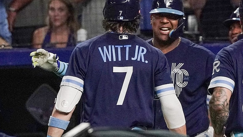 Sep 29, 2023; Kansas City, Missouri, USA; Kansas City Royals shortstop Bobby Witt Jr. (7) celebrates with first baseman Salvador Perez (13) after hitting his 30th home run of his career, a two run home run against the New York Yankees in the seventh inning at Kauffman Stadium. Mandatory Credit: Denny Medley-USA TODAY Sports