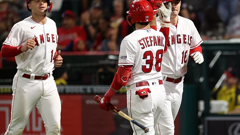 Sep 29, 2023; Anaheim, California, USA;  Los Angeles Angels center fielder Mickey Moniak (16) is greeted by third baseman Michael Stefanic (38) after hitting a home run during the fifth inning against the Oakland Athletics at Angel Stadium. Mandatory Credit: Kiyoshi Mio-USA TODAY Sports