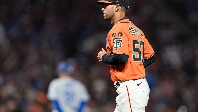 Sep 29, 2023; San Francisco, California, USA;  San Francisco Giants interim manager Kai Correa (50) returns to the dugout after lifting starting pitcher Keaton Winn (67)  during the sixth inning of the game against the Los Angeles Dodgers at Oracle Park. Mandatory Credit: John Hefti-USA TODAY Sports