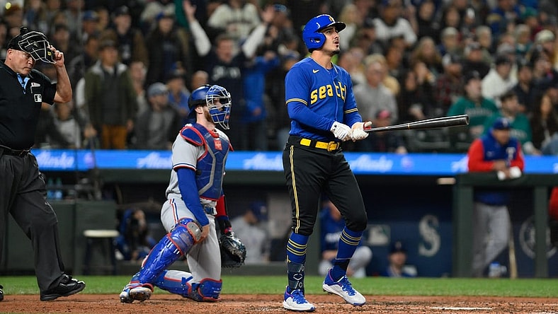 Sep 29, 2023; Seattle, Washington, USA; Seattle Mariners second baseman Josh Rojas (4) hits a home run against the Texas Rangers during the third inning at T-Mobile Park. Mandatory Credit: Steven Bisig-USA TODAY Sports