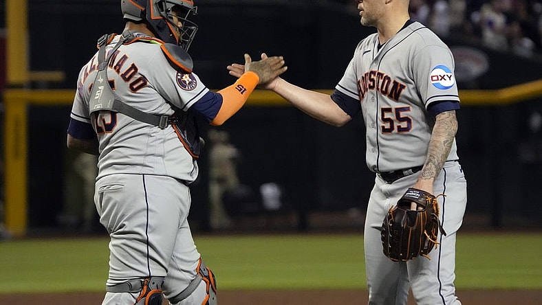 Sep 29, 2023; Phoenix, Arizona, USA; Houston Astros catcher Martin Maldonado (15) and pitcher Ryan Pressly (55) celebrates after defeating the Arizona Diamondbacks at Chase Field. Mandatory Credit: Rick Scuteri-USA TODAY Sports