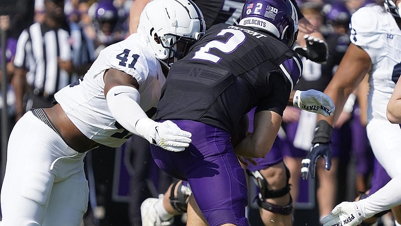 Sep 30, 2023; Evanston, Illinois, USA; Penn State Nittany Lions linebacker Kobe King (41) sacks Northwestern Wildcats quarterback Ben Bryant (2) during the first half at Ryan Field. Mandatory Credit: David Banks-USA TODAY Sports