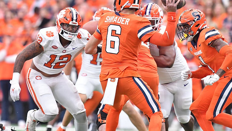 Sep 30, 2023; Syracuse, New York, USA; Clemson Tigers defensive end T.J. Parker (12) rushes Syracuse Orange quarterback Garrett Shrader (6) in the first quarter at the JMA Wireless Dome. Mandatory Credit: Mark Konezny-USA TODAY Sports